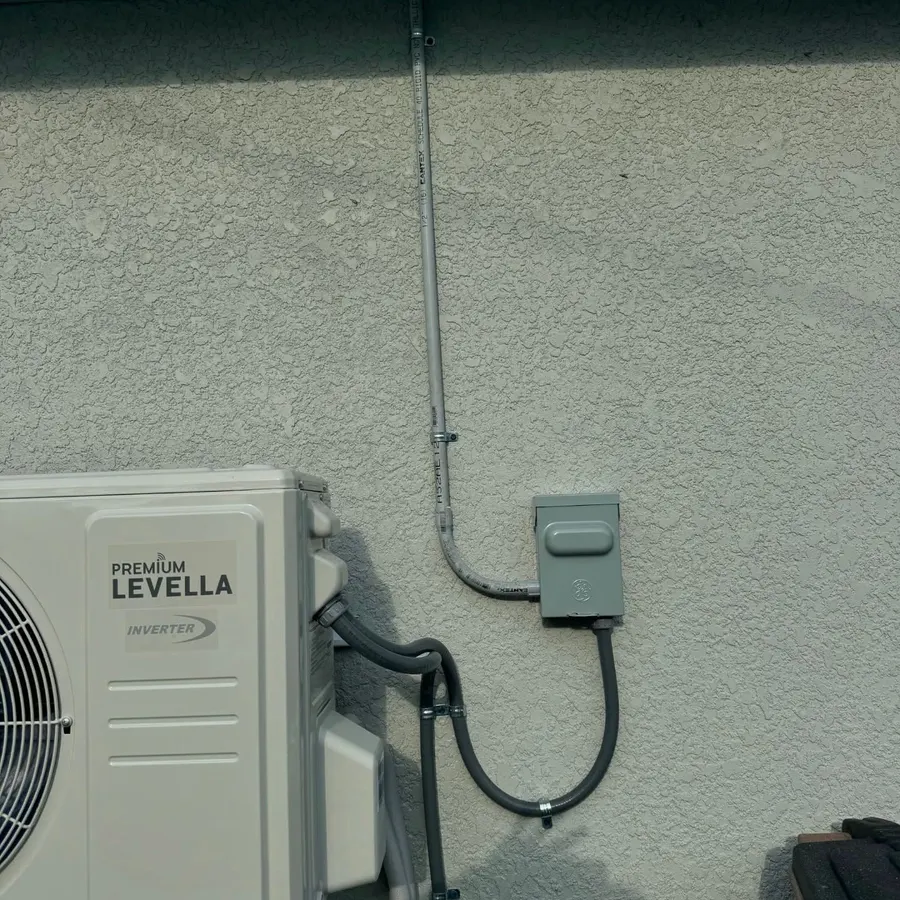 A mini split outdoor unit with a clean line-set run